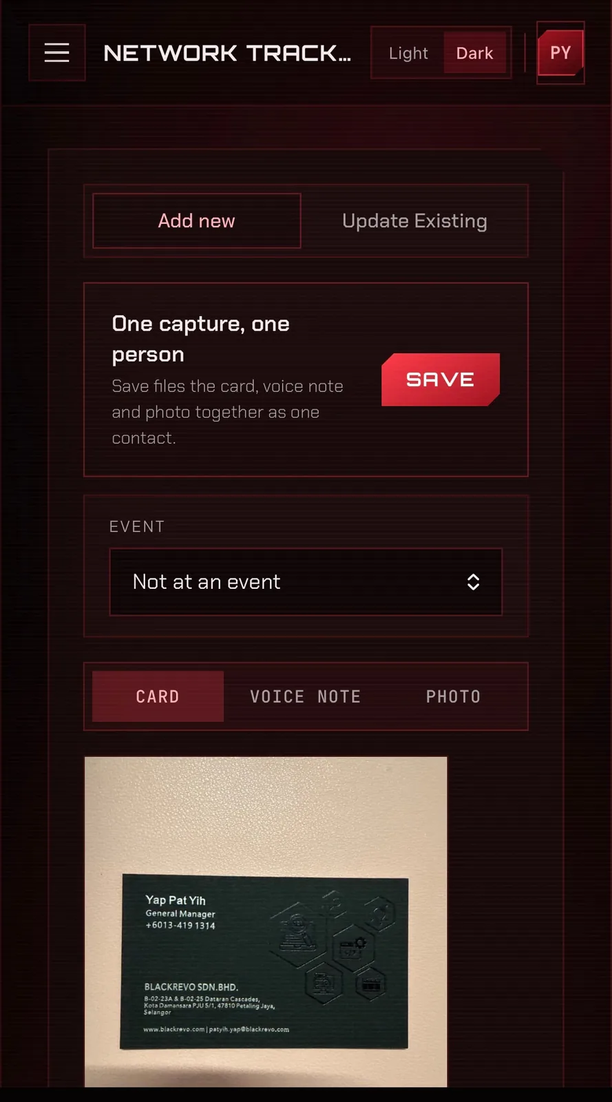 The review screen after scanning a business card, showing five extracted fields ready to check before saving