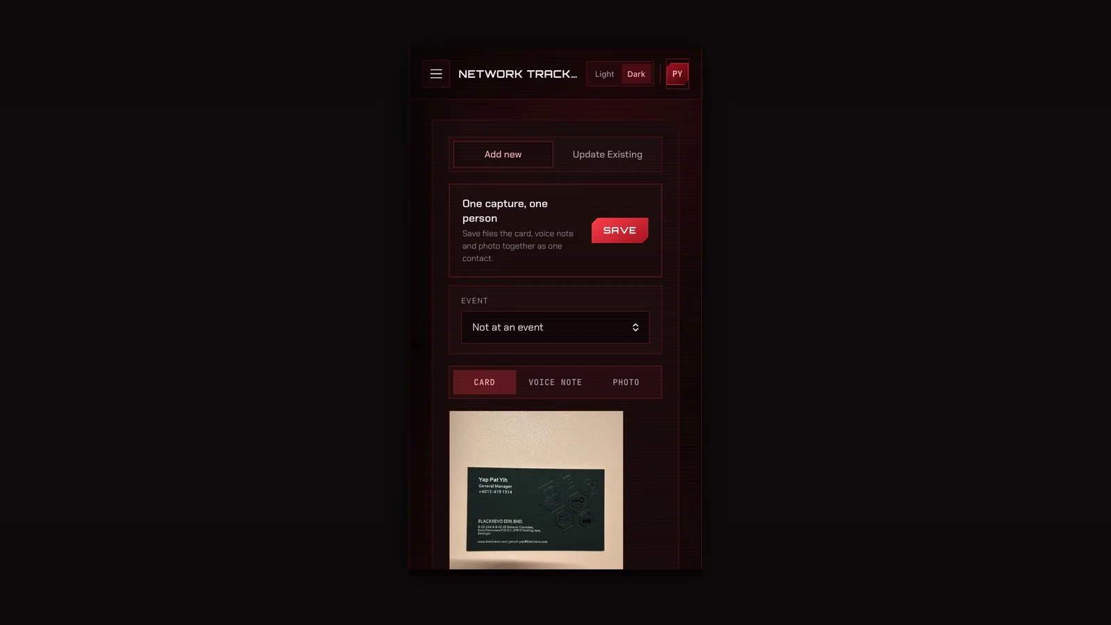 A messy business card beside its parsed output, shown as a phone screen inside a dark editorial cover frame
